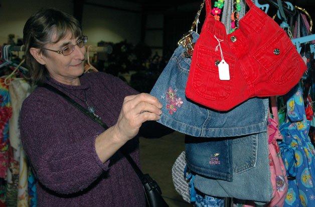 Sharon Leaf checks out the selection at Norita’s Nookery during the Dec. 16 Blue Sky Christmas Festival.