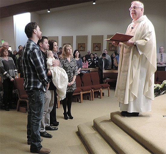 Kinley Jennifer Bumgarner was baptized Jan. 10 at Immaculate Conception Catholic Church in Arlington wearing a christening gown first worn in 1900.