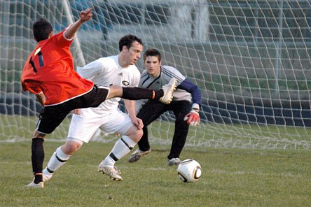 With Arlington keeper Cory Ferris looking on