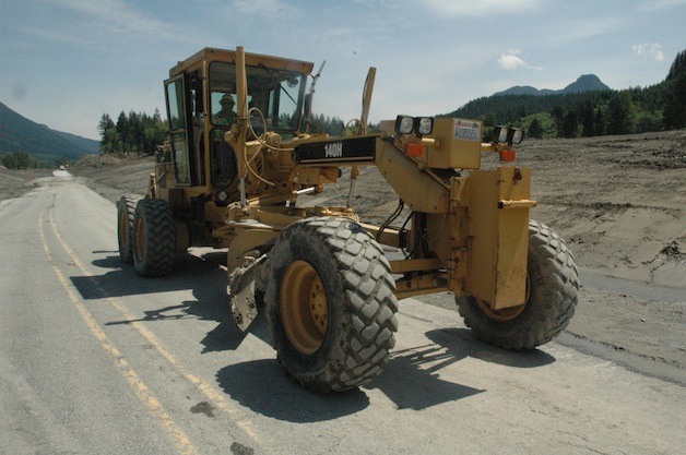 Construction crews work to get State Route 530 ready to be reopened May 31.