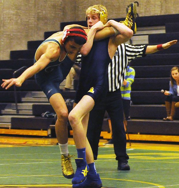 Arlington's Gavin Rork attempts takedown.