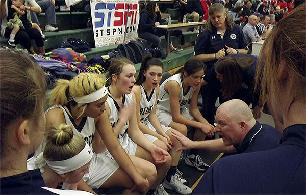 Coach Joe Marsh talks to his Arlington players