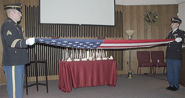 National Guardsmen get ready to fold the U.S. flag to give to surviving family members of  James Stephenson at a ceremony at Weller Funeral Home in Arlington.