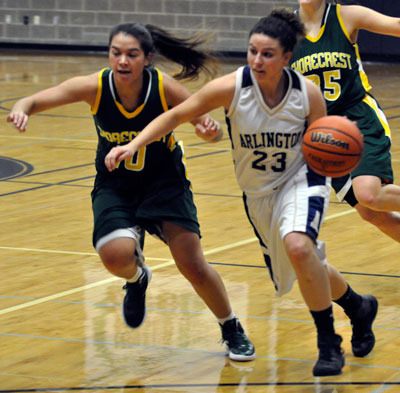 Arlington senior guard Megan Abdo drives to the paint against Shorecrest on Dec. 5.