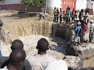 Sinkholes the size of craters now interrupt city streets in Haiti.