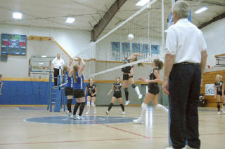 As teammates KJ Brandes and Aly Hodges look on