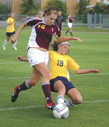 Cougars senior Alisha Stott evades a Tigers defender.