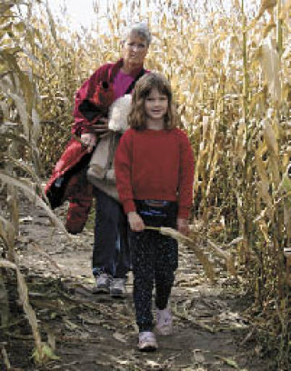 Carol Peterson and her granddaughter Sidney Scott emerge from the Casper the Friendly Ghost corn maze at Foster’s Farm Sunday