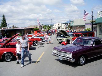 People stroll down North Olympic Avenue at the 9th annual Show-n-Shine Car Show last year; the 10th annual car show presented by the Downtown Arlington Business Association is 9 a.m. - 4 p.m.