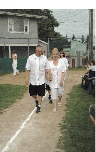 David and Shelby Wallace beam with joy after exchanging wedding vows.