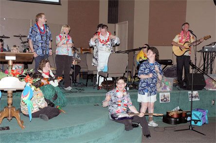 Members of Voices of the Village perform during the annual Taste of Decadence fundraiser in June. The band will perform on Sept. 12 during the second annual "Friendship Walk" in downtown Arlington.