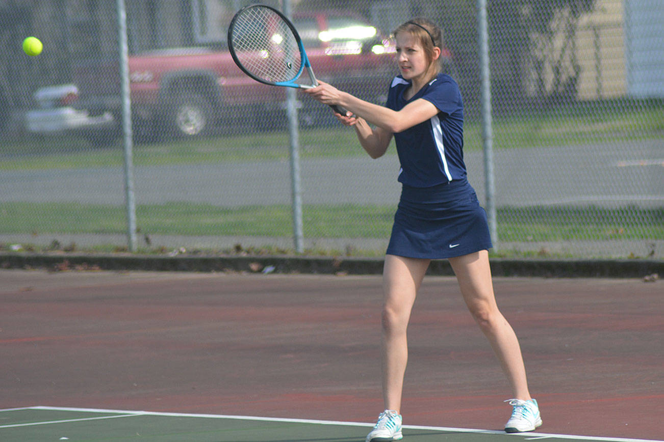 Arlington wins in tennis, but loses in softball