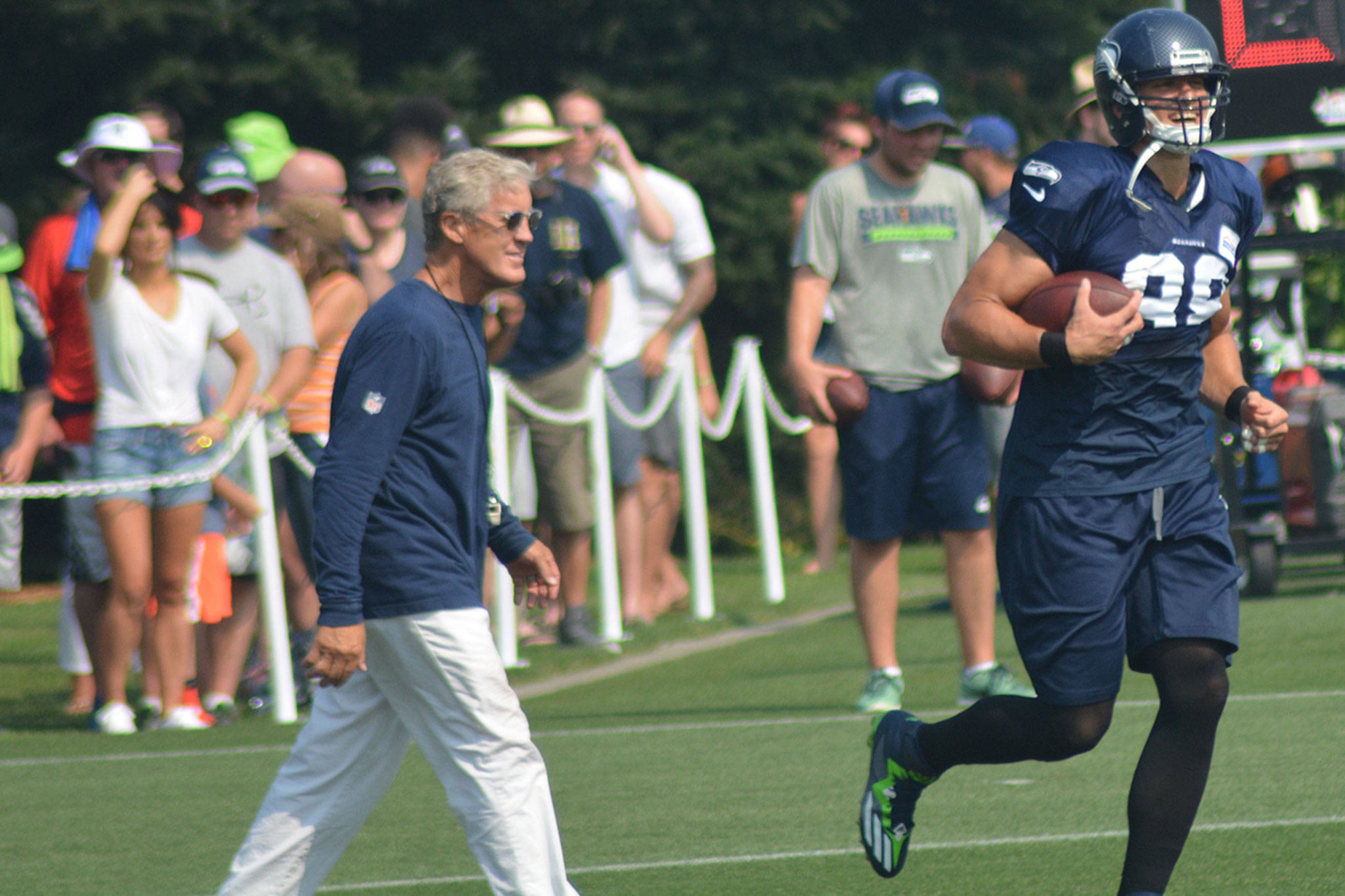 Seahawks at                                training camp                                Clockwise from left: Coach Pete Carroll talks with wide receivers Jermaine Kearse and Doug Baldwin, along with running back Thomas Rawls and quarterback Russell Wilson as they stretch; new running back Eddie Lacy powers through the line; wide receiver Tanner McEvoy pleads his case with Coach Carroll; Wilson and Rawls get set for a play; tackling on the sled drill; tight end Jimmy Graham shows off a big smile after catching a TD pass from Wilson in the red zone; and on the facing page safety Earl Thomas bumps cornerback Richard Sherman during a drill. Seattle opens its preseason Sunday at the Los Angeles Chargers. Once the final roster is pinnned down, the Seahawks will open the regular season against the Packers in Green Bay Sept 10. For a story and many more photos check us out online at www.marysvilleglobe.com